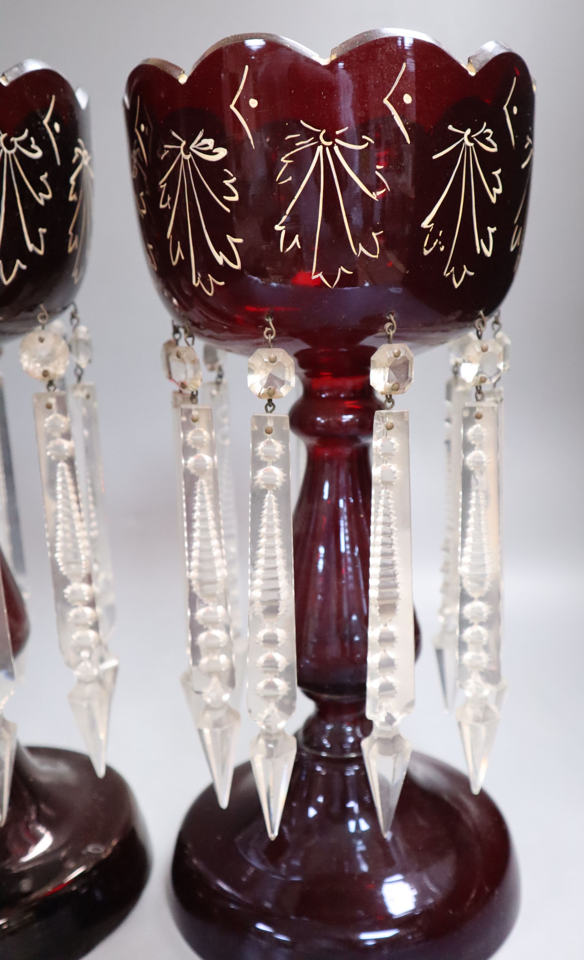 A pair of Victorian ruby glass lustres, height 34cm